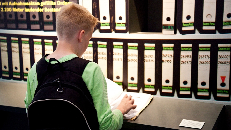 Child in front of files